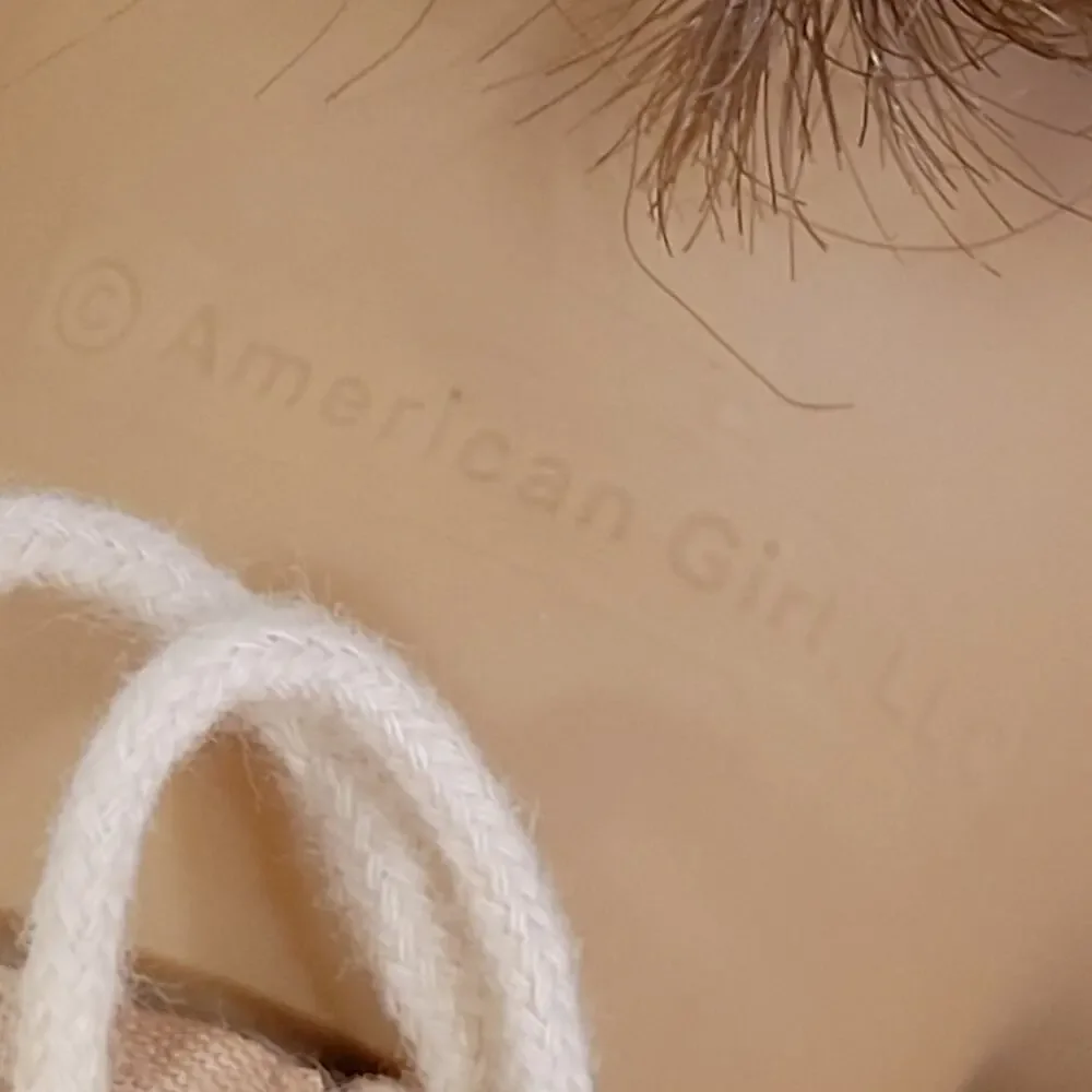 American Girl Doll Grey eyes light brown  hair.